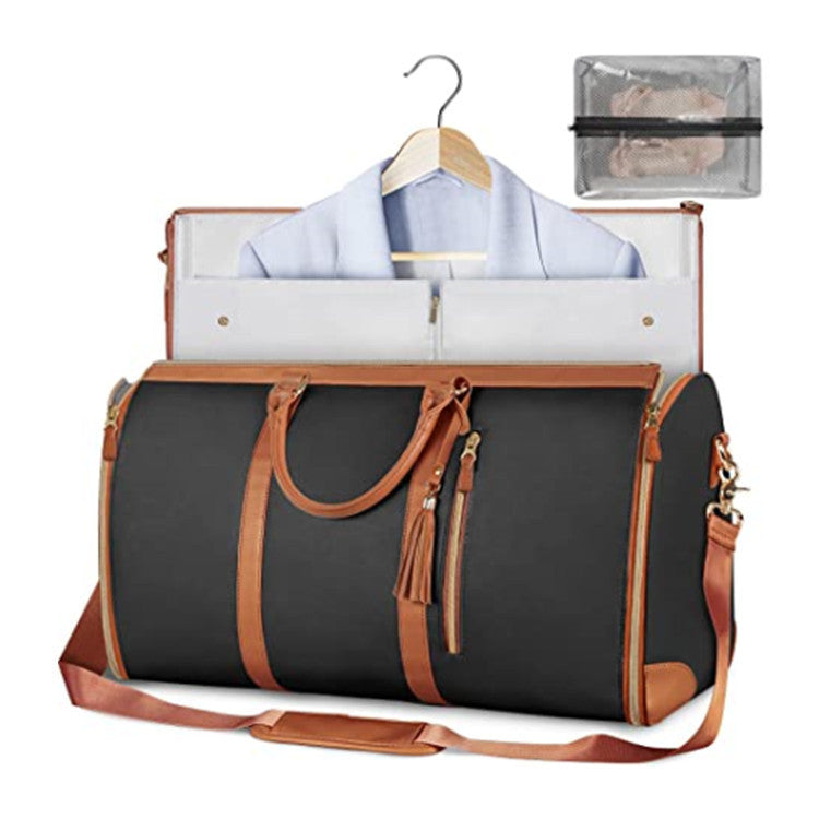 Black duffel bag with brown handles and trim, open to reveal a shirt on a hanger, on a white background.
