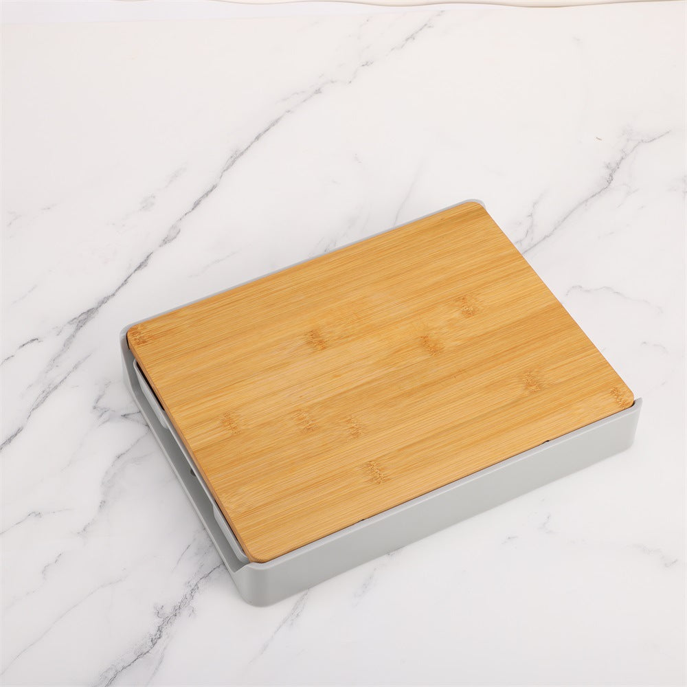 Wooden cutting board with metallic base on a marble surface